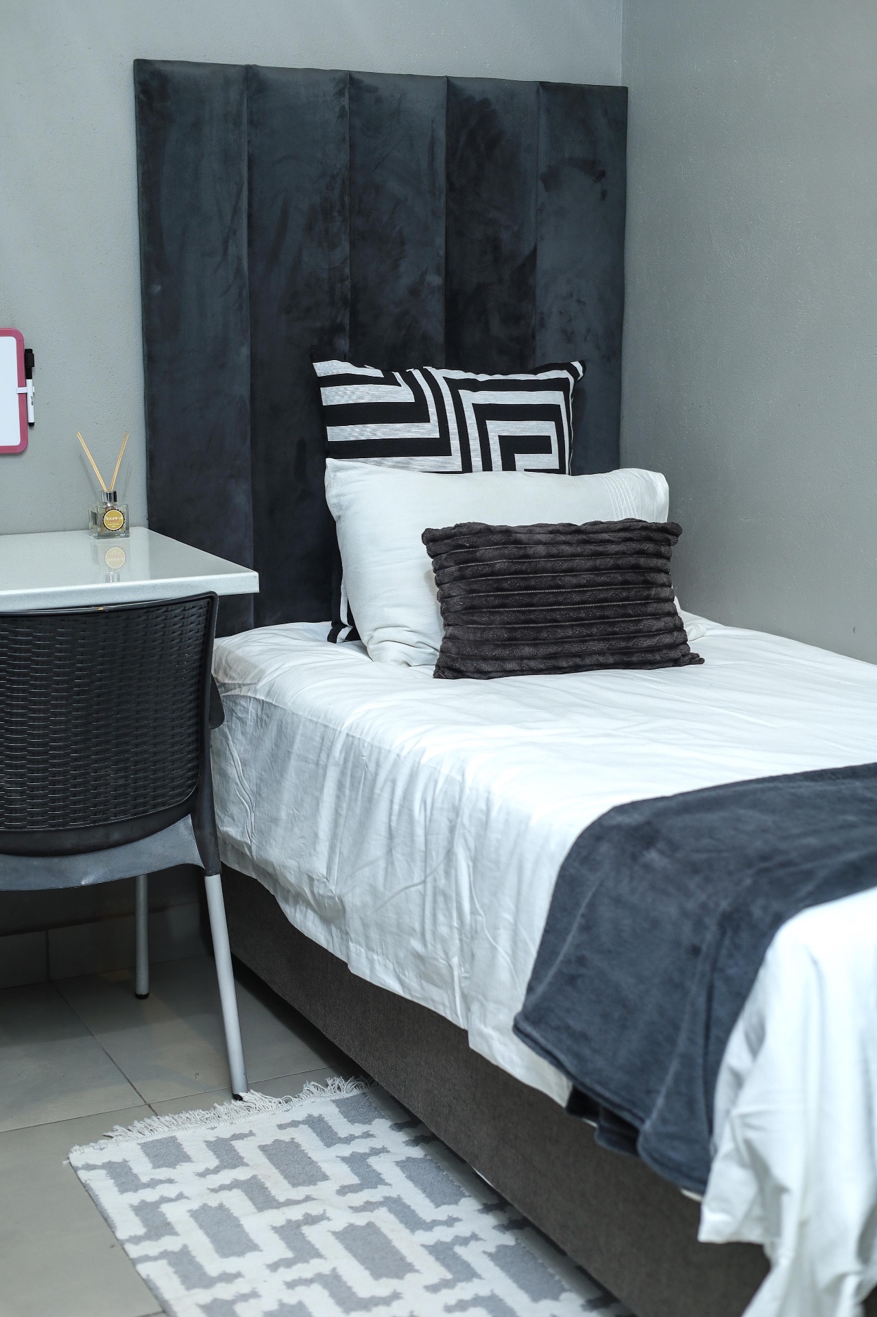 A student bed made up for a comfortable night's rest