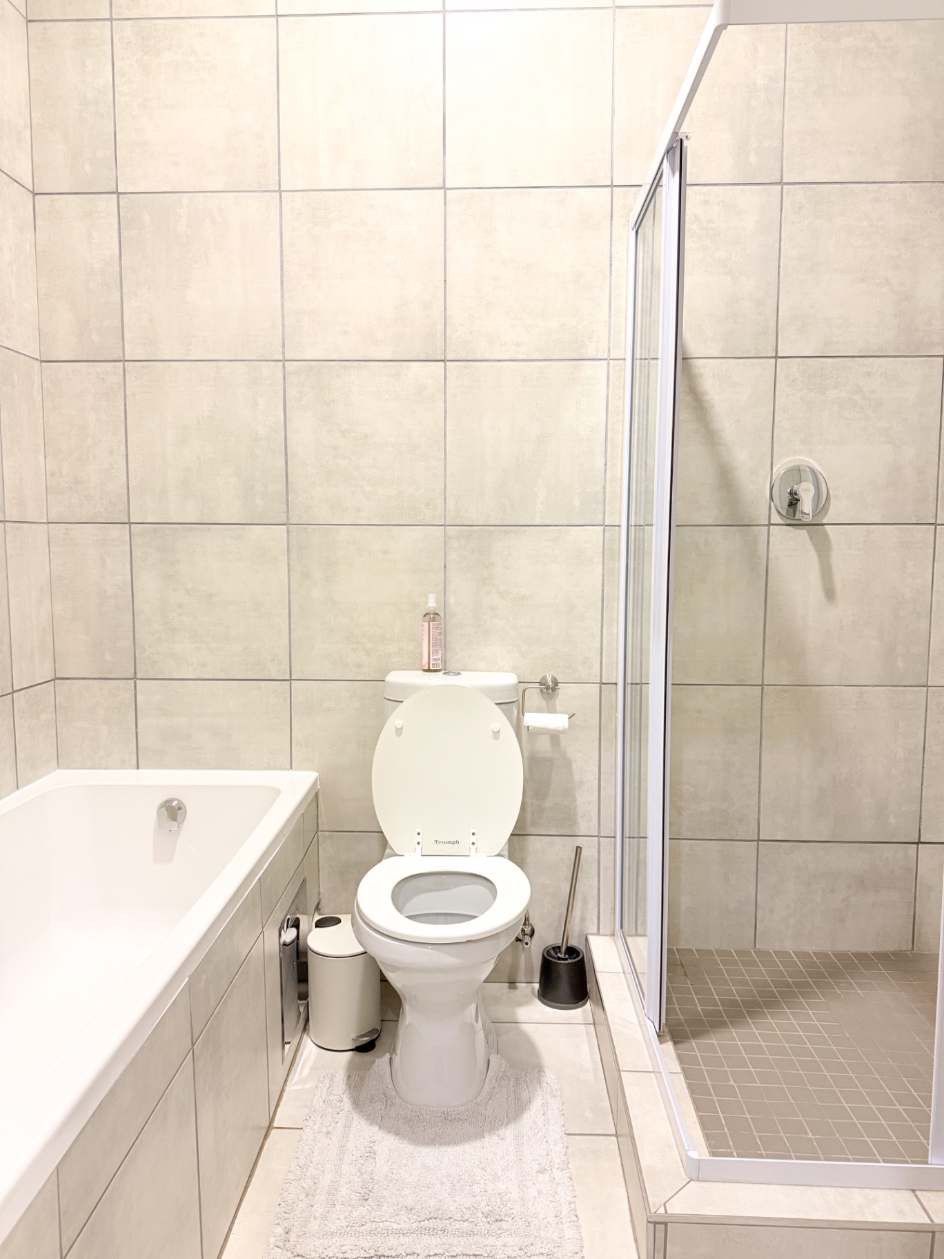 Family bathroom with bathtub and shower