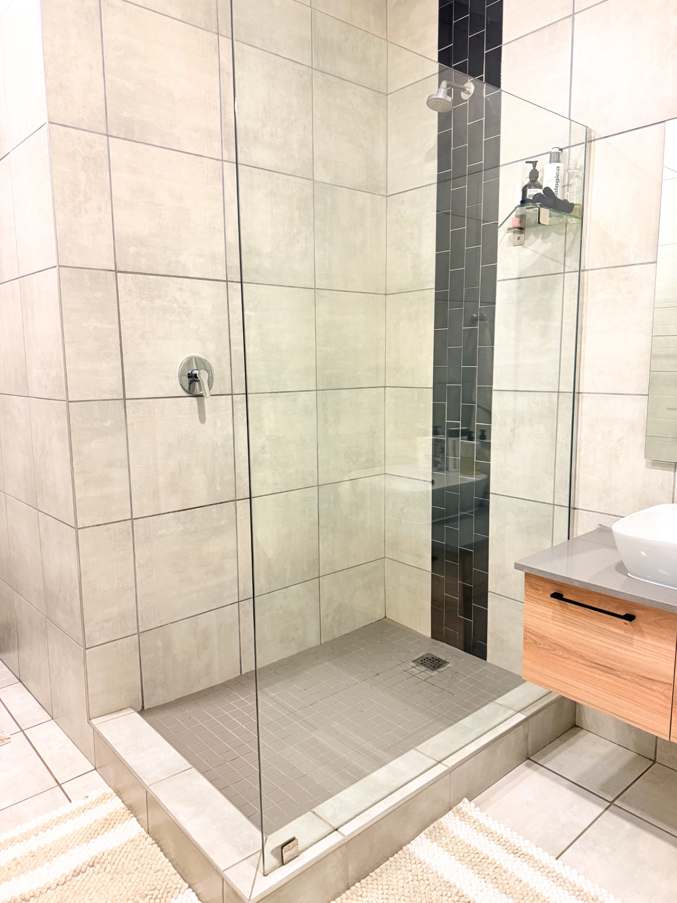 En-suite walk-in shower with frameless glass