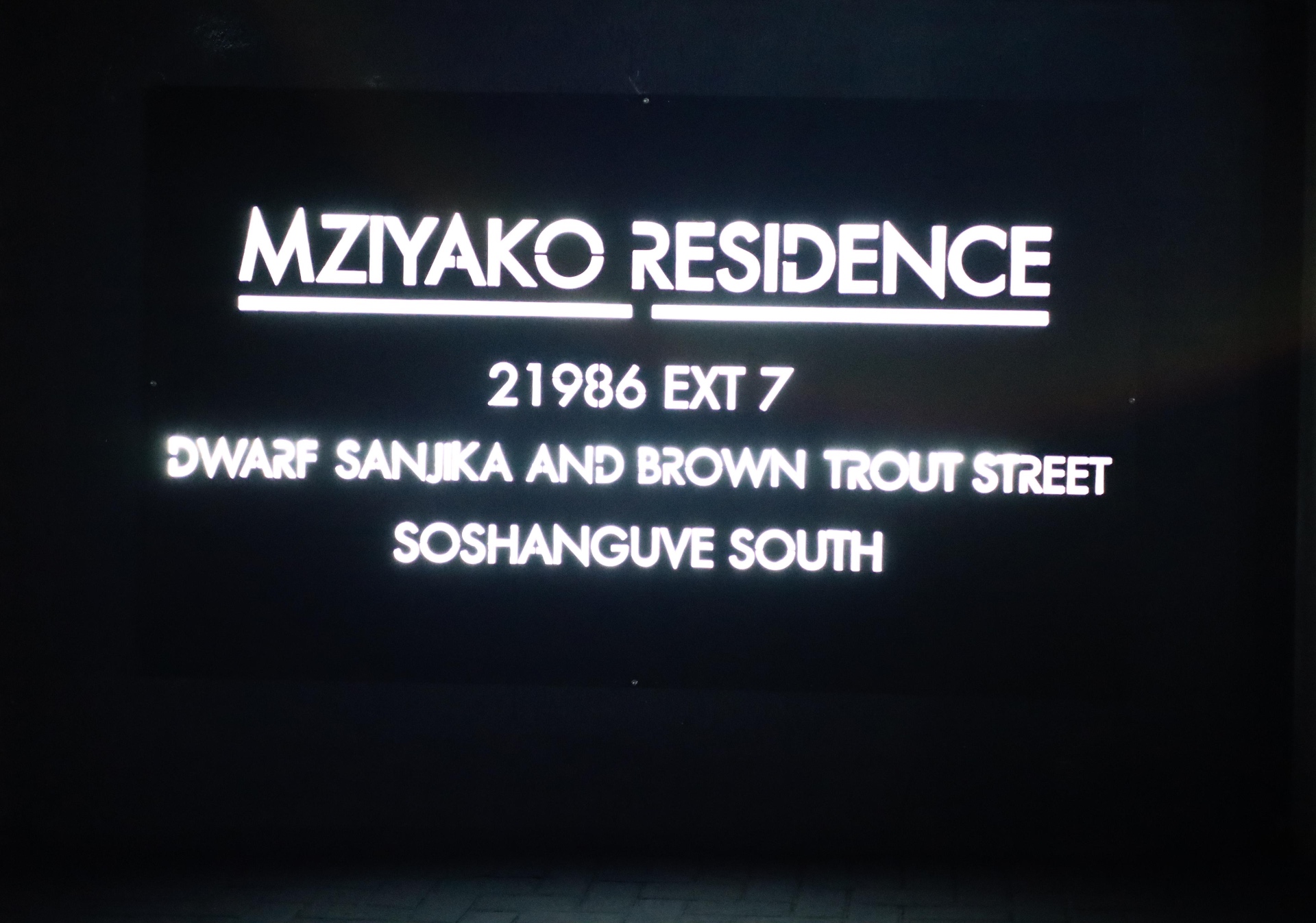 Illuminated Mziyako Residence signage