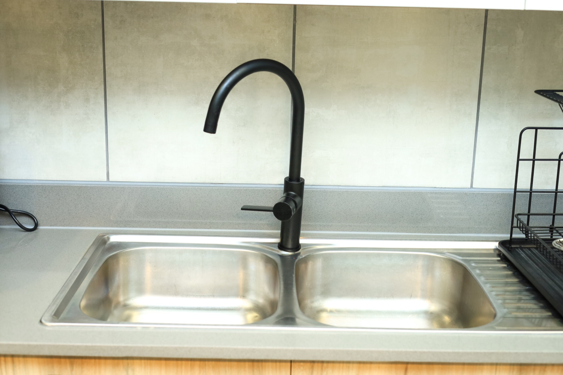 Black tapware and stainless sink